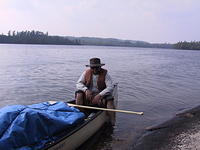 Pete about to get off the canoe and onto dry land